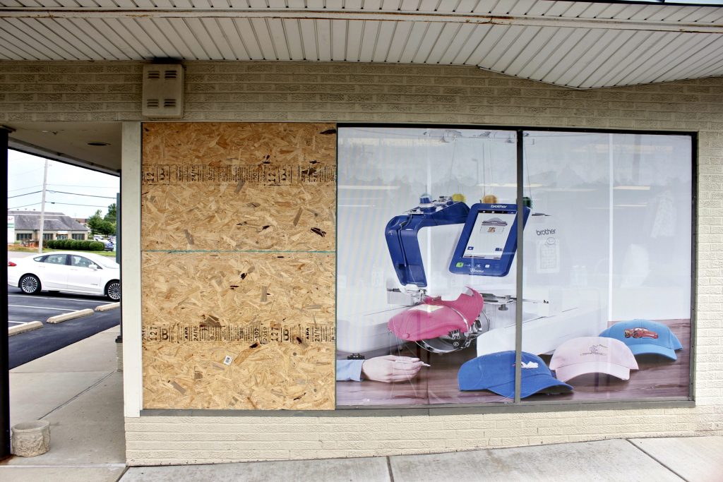 Pictured+above%3A+A+piece+of+plywood+is+used+to+temporarily+cover-up+the+broken+window+at+Heyde+Sewing+Machine+Company+on+Lindbergh+Boulevard+after+two+suspects+broke+through+the+window+the+morning+of+Saturday%2C+June+15+and+stole+two+sewing+machines.+Each+machine+cost+%2420%2C000+each+and+police+are+still+investigating+the+burglary.+Photo+by+Erin+Achenbach.+