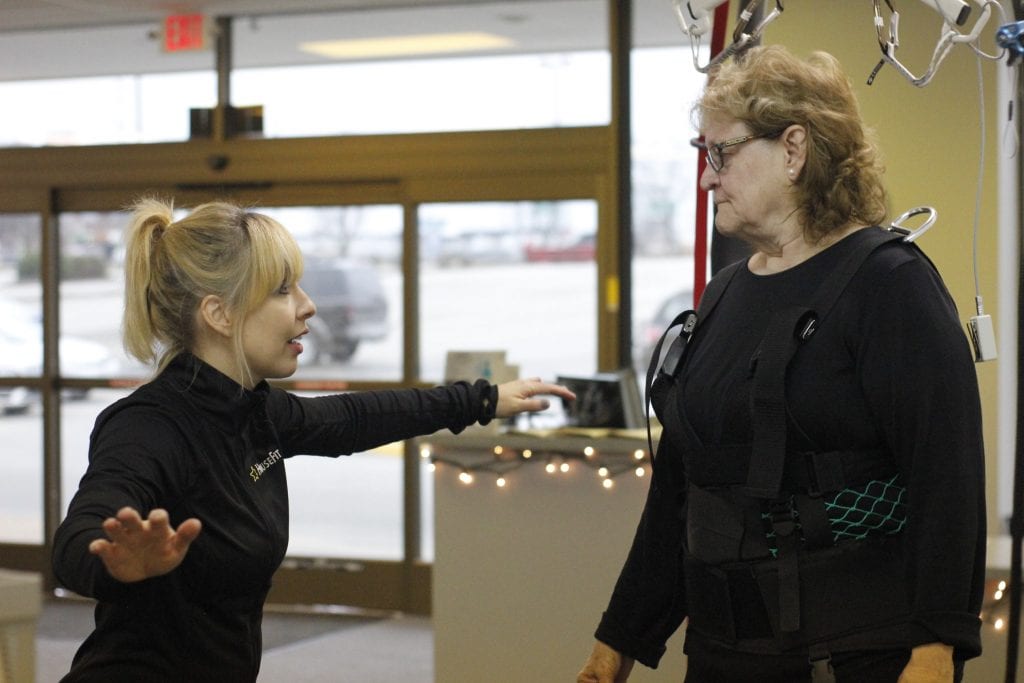 Beth Templin gives advice to Cindi Templin during the latters physical therapy session on the ActiveStep at HouseFit in December 2018.