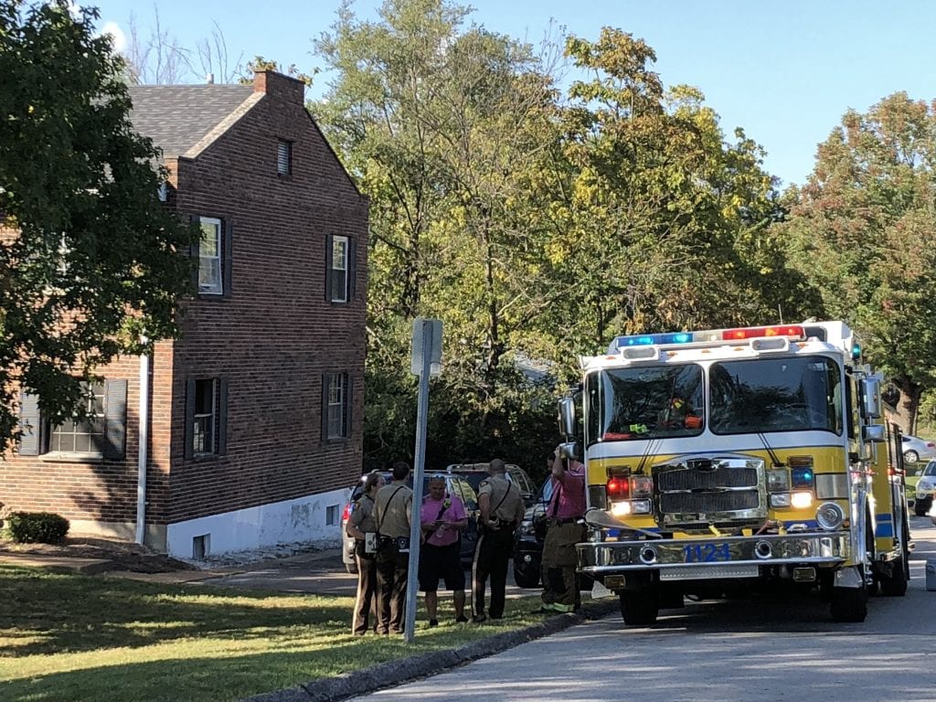 St.+Louis+County+police+and+first+responders+gather+outside+an+apartment+complex+off+Kidder+Road+in+Affton+on+Tuesday.+A+woman+was+found+shot+after+an+apartment+at+the+complex+was+set+ablaze.+Photo+by+Erin+Achenbach.