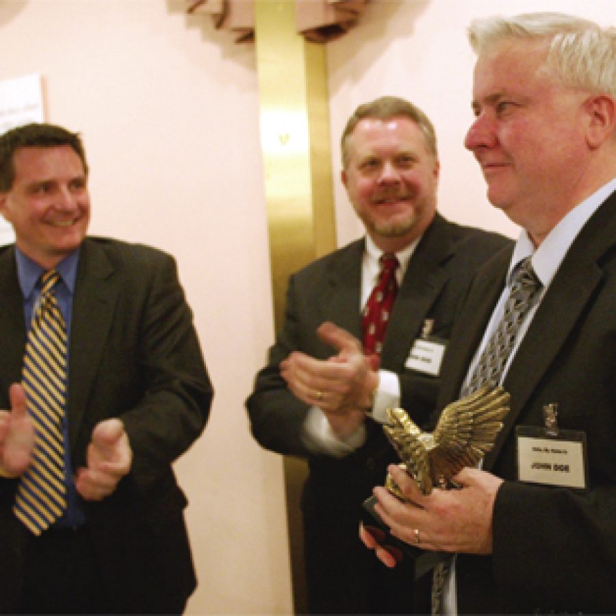 Attorney Jerry Wamser, right, holds a brass eagle presented to him by members of the John Doe Society for outstanding service to the cause of free speech in south county. Presenting the award, from left, are: attorney Les Stuckmeyer and Tom Diehl. An appellate court last week denied a motion to rehear Fred Weber Inc.s \$5 million libel and defamation lawsuit against Diehl.