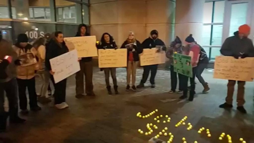 Johnny Shys friends gather for a vigil outside the Justice Center in March 2019 after Shys death in the jail.