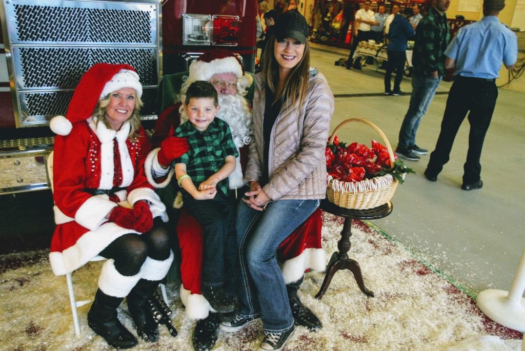 Pictured above with the jolly fat man are Liam Juelfs, 4, and his mother Sarah. Photo by Bill Milligan.