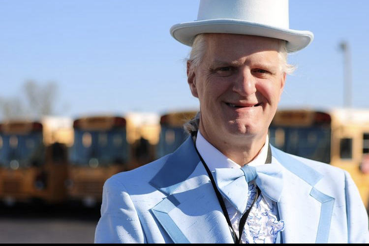 Kevin+Hughes+was+named+Transportation+Classified+Employee+of+the+Year+by+the+Mehlville+School+District+in+May.+Hughes%2C+himself+an+alumnus+of+Mehlville+High+School%2C+likes+to+dress+up+in+funny+costumes+to+entertain+the+students+on+his+routes.+%E2%80%9CI+try+to+make+the+workplace+fun+and+make+people+laugh.+I%E2%80%99ve+done+that+since+I+was+a+child%2C%E2%80%9D+said+Hughes.