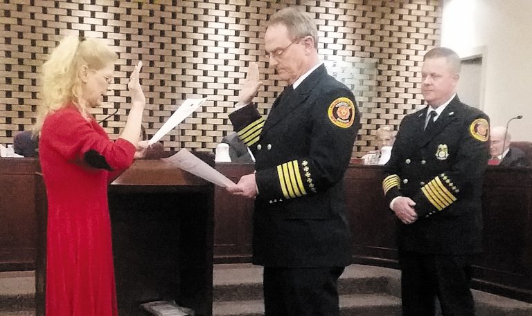 Crestwood+Assistant+Fire+Chief+Lou+Hecht%2C+center%2C+takes+the+oath+of+office+during+a+city+meeting+in+May+2017.+Deputy+City+Clerk+Theresa+Pfyl+administered+the+oath+to+Hecht%2C+who+previously+served+as+deputy+chief+with+the+Fenton+Fire+Protection+District.+Also+pictured+is+former+Fire+Chief+David+Oliveri.
