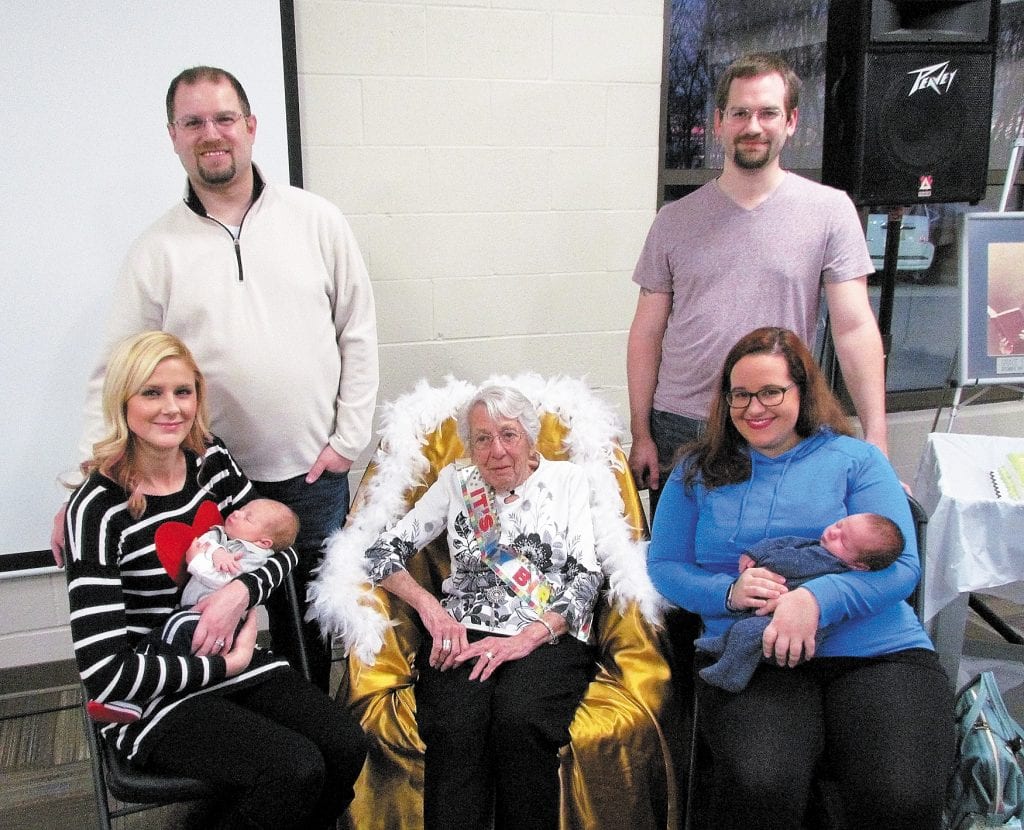 To celebrate Mary Halliburton’s 100th birthday, she posed with two of South County Baptist Church’s babies born this year, 100 years after her. Pictured, from left, are: A.J. Hof with parents Keri and Adam Hof; Halliburton; and Jensen Leslie with parents Alexandra and Bradley Leslie.