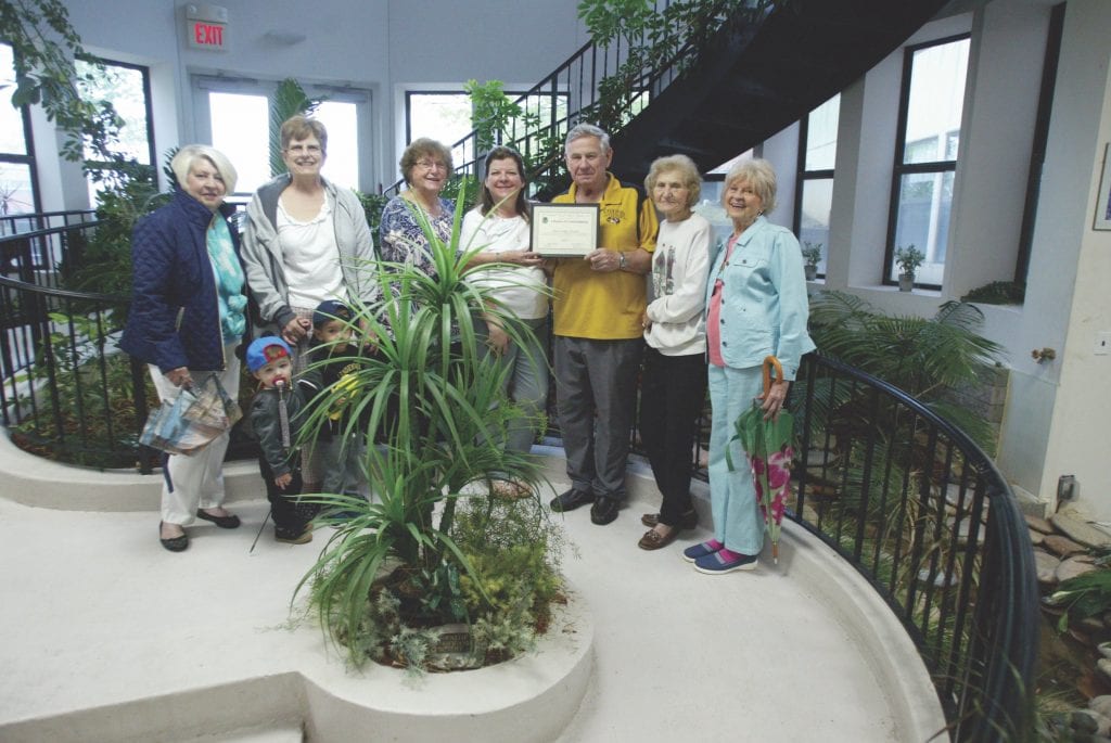 The Mehlville Garden Club issues a beautification citation to First Unity Church in Concord. Photo by Bill Milligan.