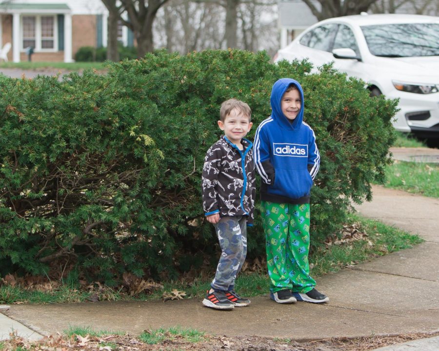 Students at Wohlwend Elementary in Oakville, above, along with Rogers and Forder, stood
outside their houses Sunday to wave as their teachers drove by in a parade.