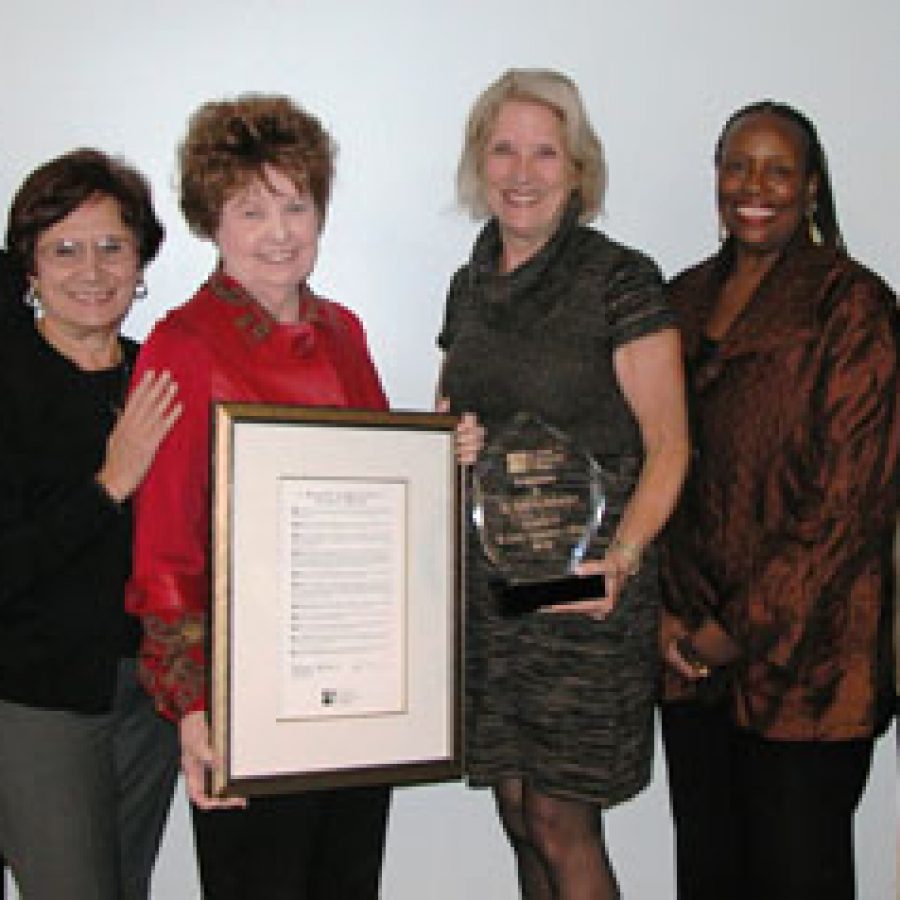Joann Ordinachev, third from left, receives a proclamation for 16 years of service on the St. Louis Community College Board of Trustees. Other members of the board include, from left, Margo McNeil, Libby Fitzgerald, Melissa Hattman, Hattie Jackson and Craig Larson.