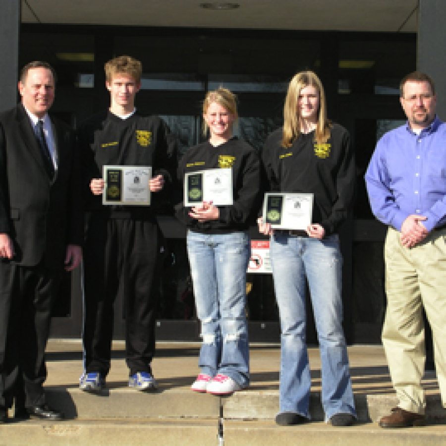 Three Oakville Senior High students recently received Athlete of the Month honors. Pictured, from left, are: Donald Olenyik of Edward Jones Investments, Scott Greubel, Miriam Wegmann, Emily Austin and Don Beile of Priority One Promotional Products and Services.