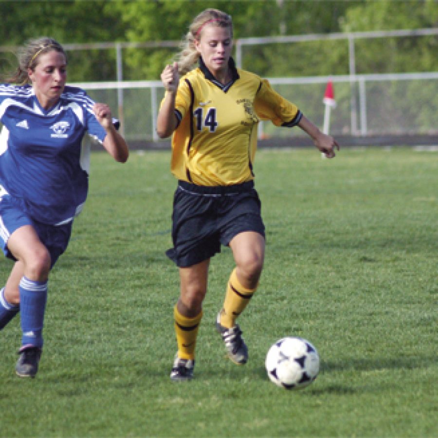 Oakville senior Jenna Milward breaks past a Northwest defender on her way to her second goal in Oakvilles 7-0 victory over the Lions.