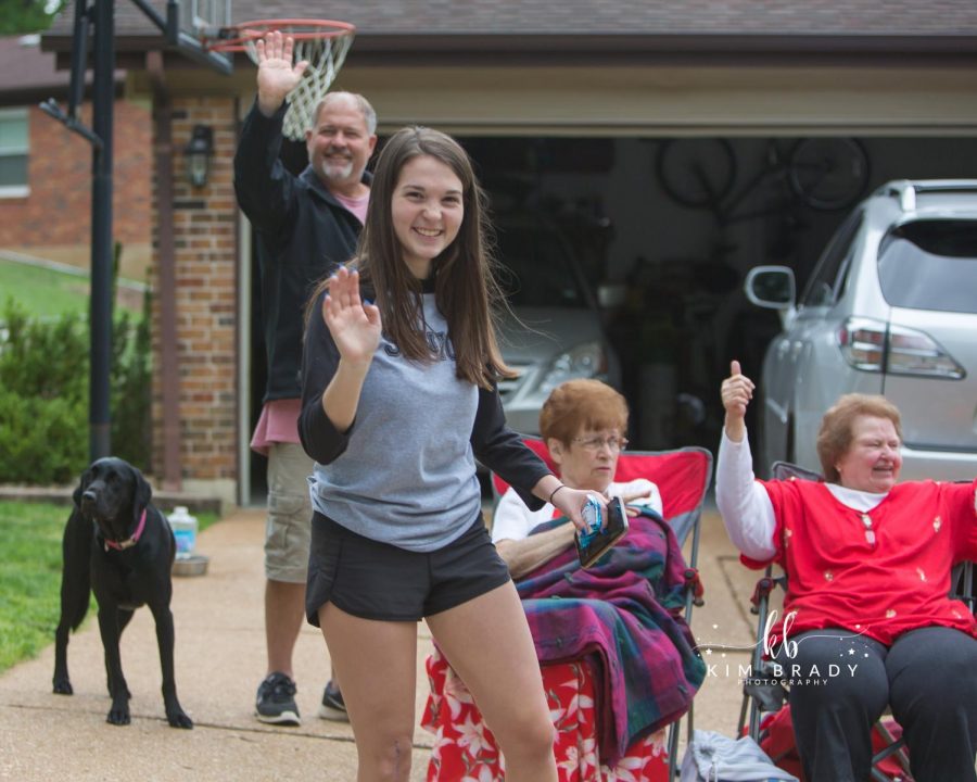 Oakville High graduates like Lauren Long, above, and their families celebrated the Class of 2020’s achievements with a drive-by graduation parade last week. Officials still hold out hope that despite the coronavirus pandemic, in-person graduation ceremonies can be held later this summer.