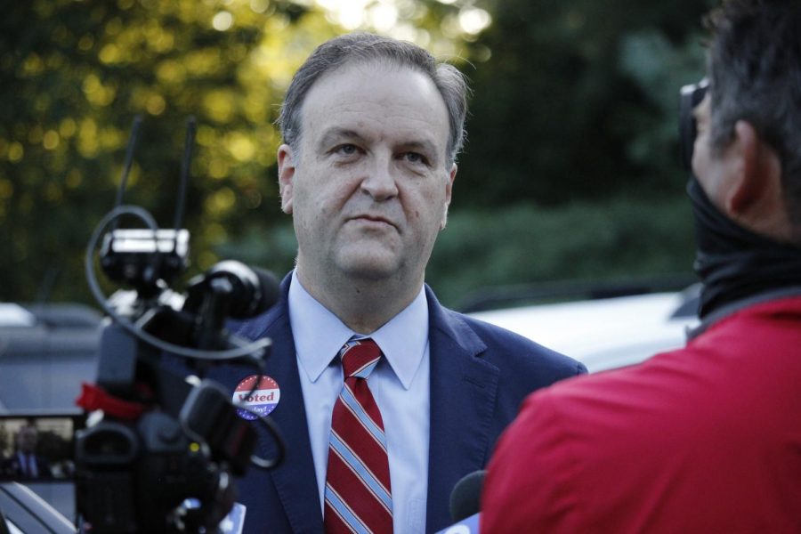 St. Louis County Executive Sam Page speaks to reporters after voting Aug. 4, 2020, in Creve Coeur  in the Democratic primary.