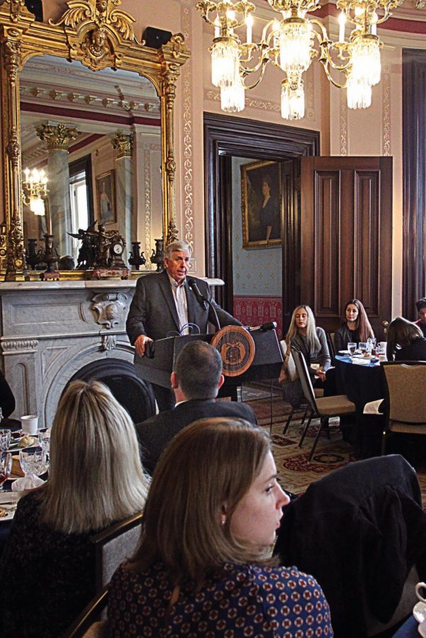 At the Governor’s Mansion during the Missouri Press Association’s Jan. 31 Day at the Capitol, University of Missouri-Columbia journalism student Veronica Mohesky, an Oakville High graduate, listens to Gov. Mike Parson discuss 2020 issues including gun control and Medicaid expansion. 