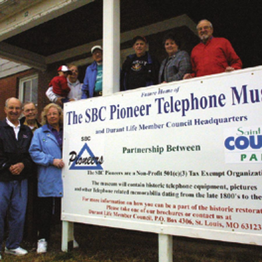 Volunteers have been working to renovate the former officers quarters at 1214 Hancock in Jefferson Barracks to create a telephone museum. Pictured, from left, are: Bob Bannecker of Concord, Harold and Joan Delaney of Oakville, 4-year-old Henry Johannes and Carol Johannes of Lemay, Bill Nienaber of Man-chester, Bill and Dee Dupree of Arnold and George Scanlon of Crestwood.