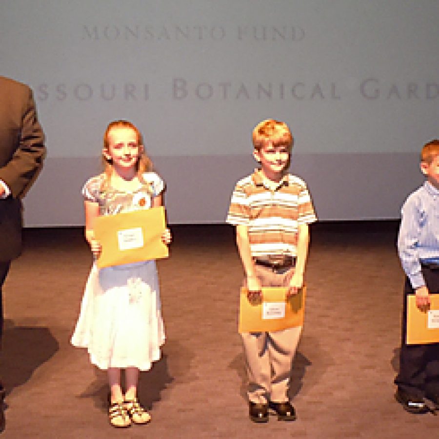 Grace Embry, Adam Koetting and Henry McIntyre of Our Lady of Providence School in Sappington won the digital category for their PowerPoint presentation on sassafras featuring hand-drawn artwork of trees and leaves in the Missouri Botanical Gardens \Power of Plants\ student contest. They are joined by Peter Wyse Jackson, president of the garden and Janet M. Holloway, Monsanto senior vice president, chief of staff and community relations, and a member of the Monsanto Fund board.