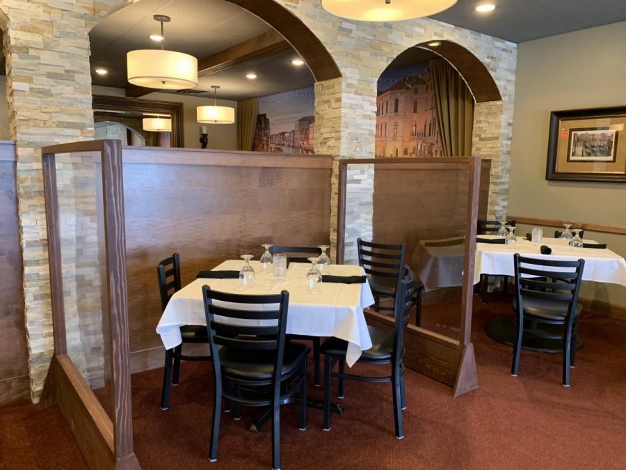 A table at Roberto’s Trattoria in Sappington is shown surrounded by the new Plexiglas barrier shield June 18, 2020. 