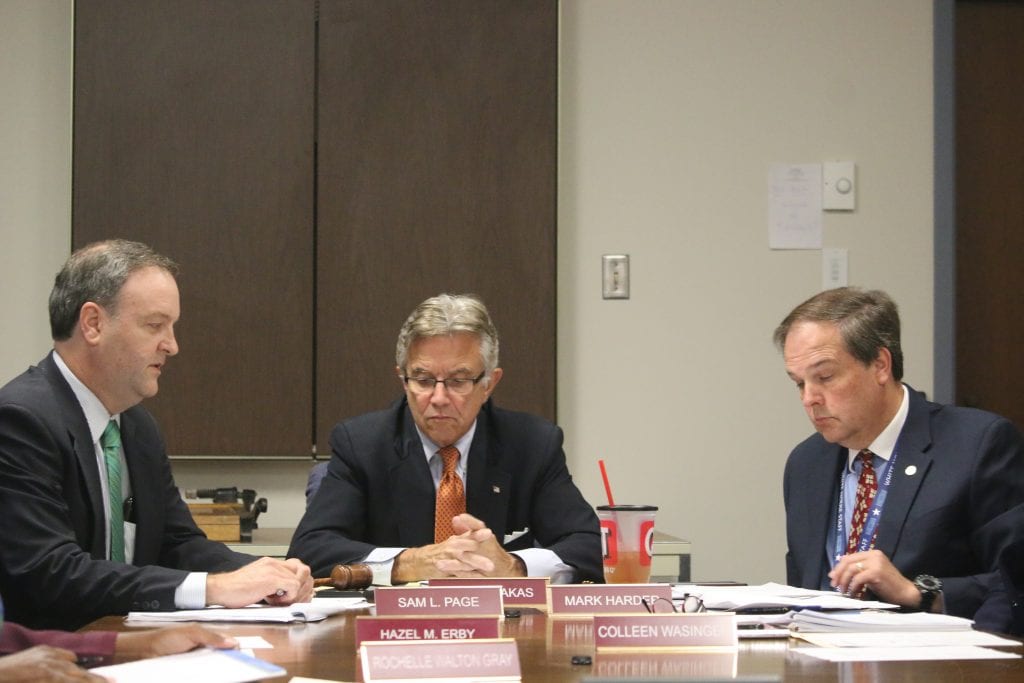 Councilmen Sam Page, Ernie Trakas and Mark Harder read over documents at the Ethics Committee meeting July 24, 2018. Photo by Jessica Belle Kramer.