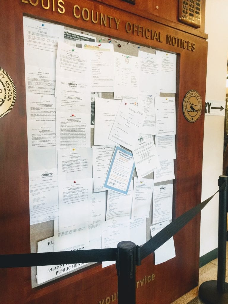 The St. Louis County public notice bulletin board on the ground floor of the Government Center, as seen the day of an emergency council meeting July 27. The 24-hour notice for the meeting is second from the top on the far right.