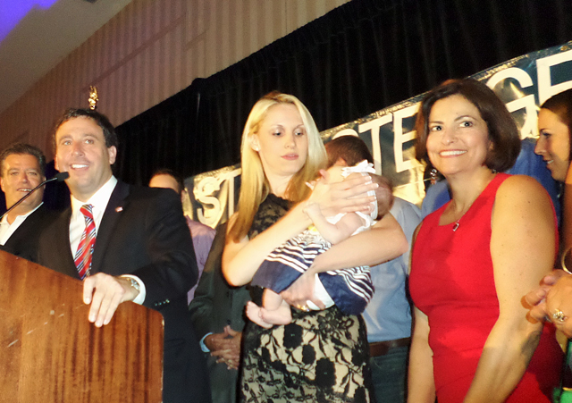 Steve Stenger, left, celebrates his Democratic primary victory in August 2014, along with, from left, Stengers wife Allison, their daughter Madeline Jane and Stengers legislative assistant Linda Henry. Photo by Gloria Lloyd.