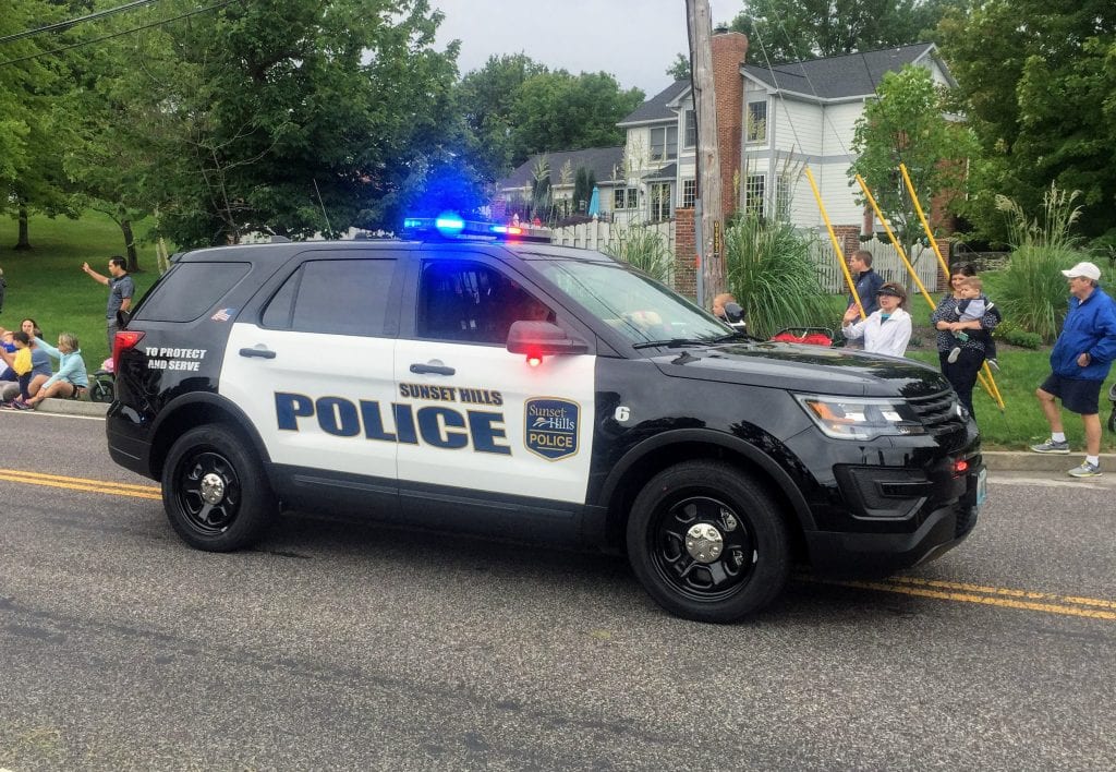 The Sunset Hills Police Department drives in the SunCrest Fest parade in September 2018.