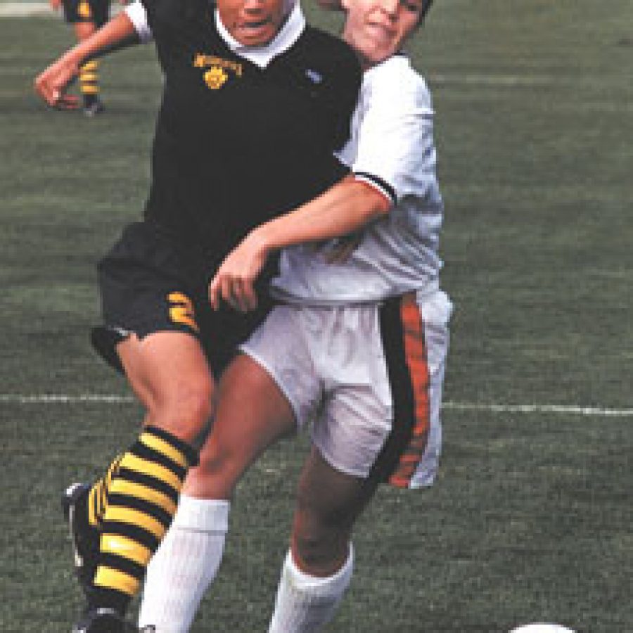 Former Lindbergh High School soccer star Nikki Thole, left, is the most decorated player in University of Missouri soccer history.