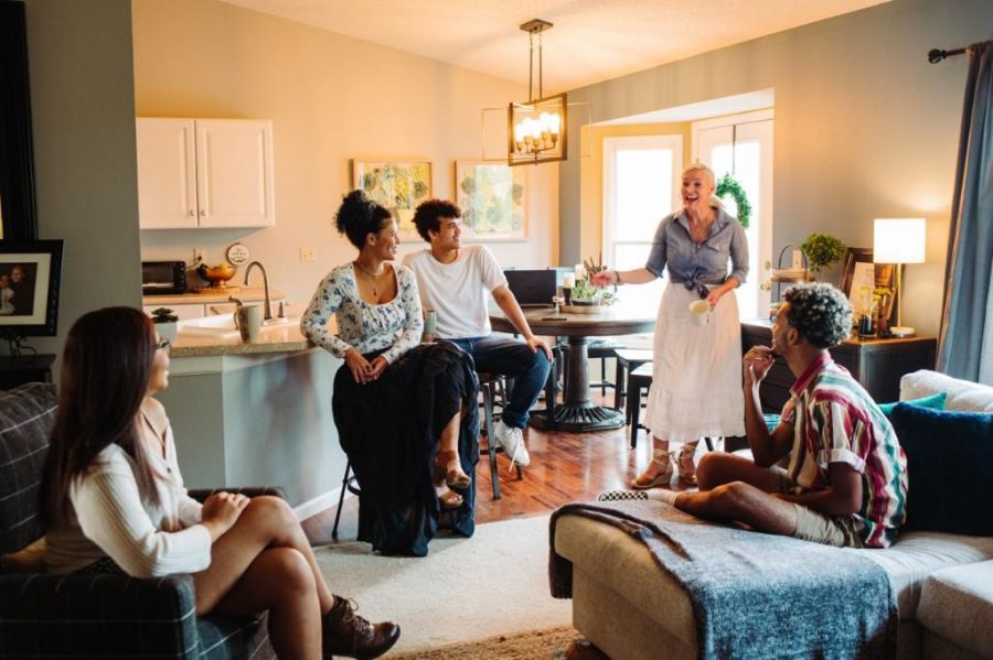 Tracy Verner (far right, standing), talks with her children at their home in St. Louis. They will spend Thanksgiving at home with just immediate family. (photo submitted)