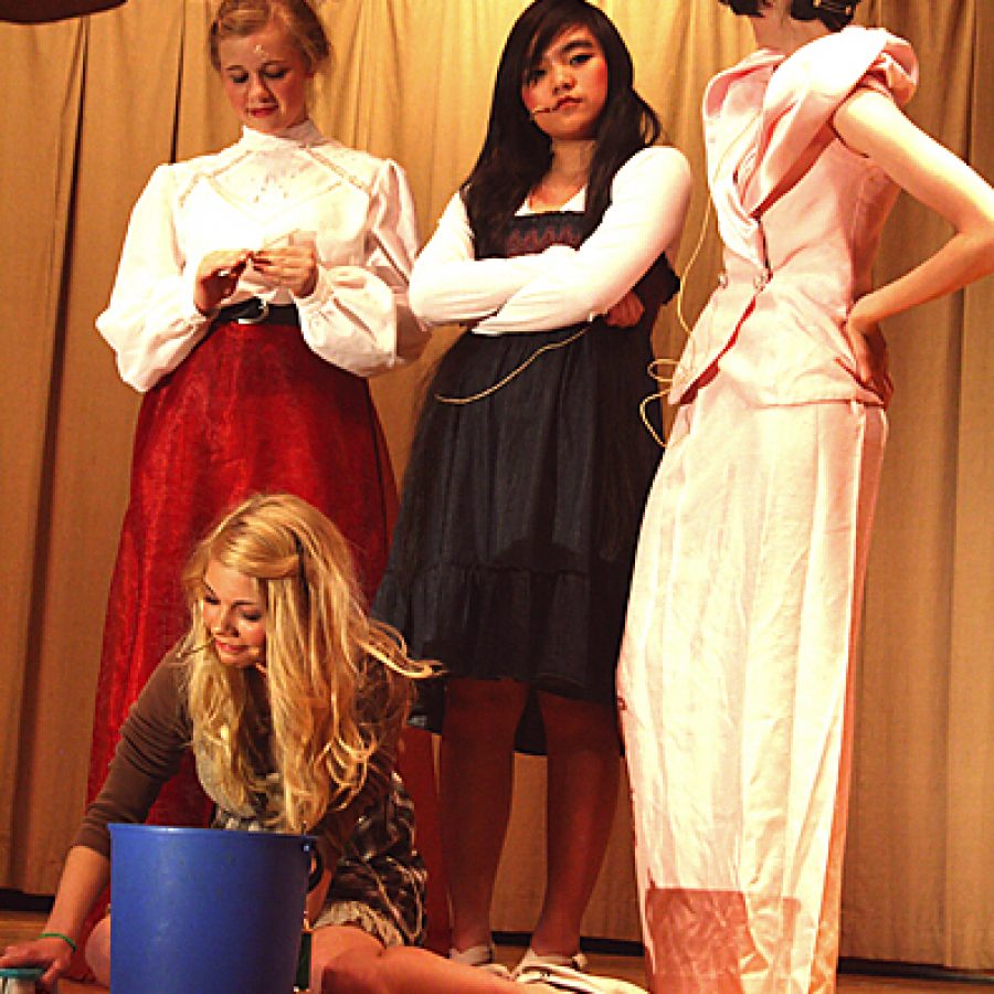 Caley Roberts portrays Cinderella in Green Park Lutheran Schools performance of Twinderella. Standing, from left, are: Raechel Reinitz as the cruel stepmother and Marie Nguyen and Gabby Darnell as Cinderellas evil stepsisters, Esmerelda and Ethel.