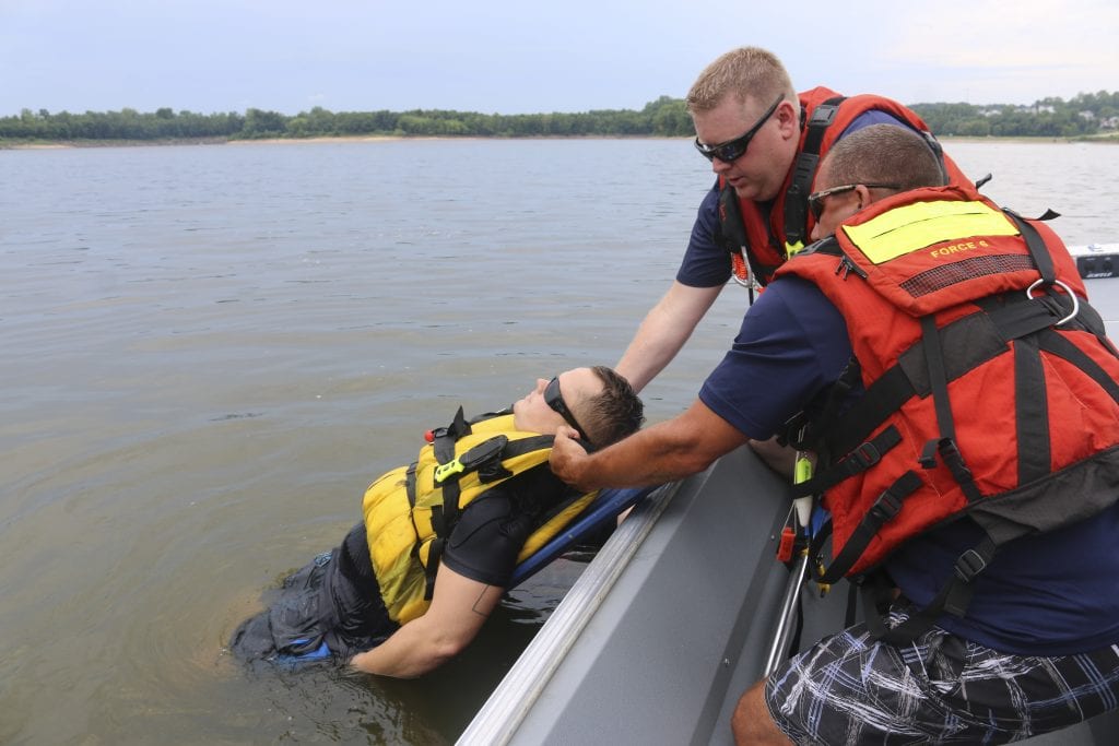 MFPD firefighter-medics David Wideman and Capt. Nick Larosa pull Jared Sarni out of the water during a mock water rescue practice in 2018.