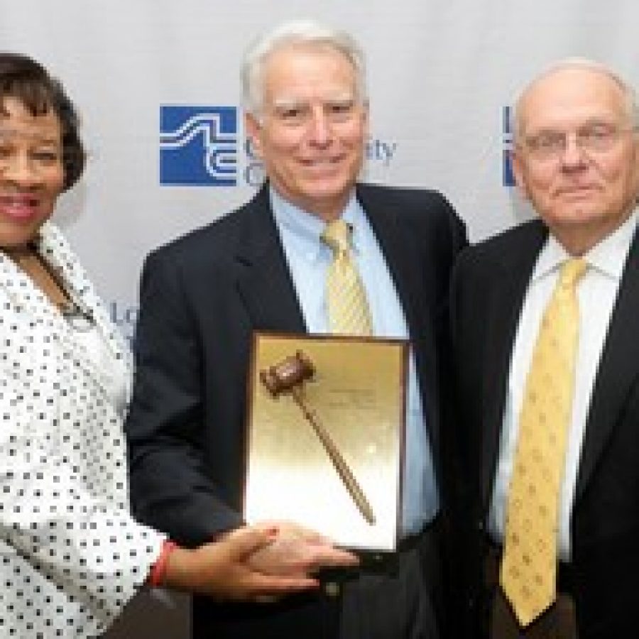 Craig Larson recently was re-elected chairman of the St. Louis Community College Board of Trustees. Pictured, from left, are: Doris Graham, outgoing vice chairwoman; Larson; and Dennis Michaelis, STLCC's interim chancellor.  