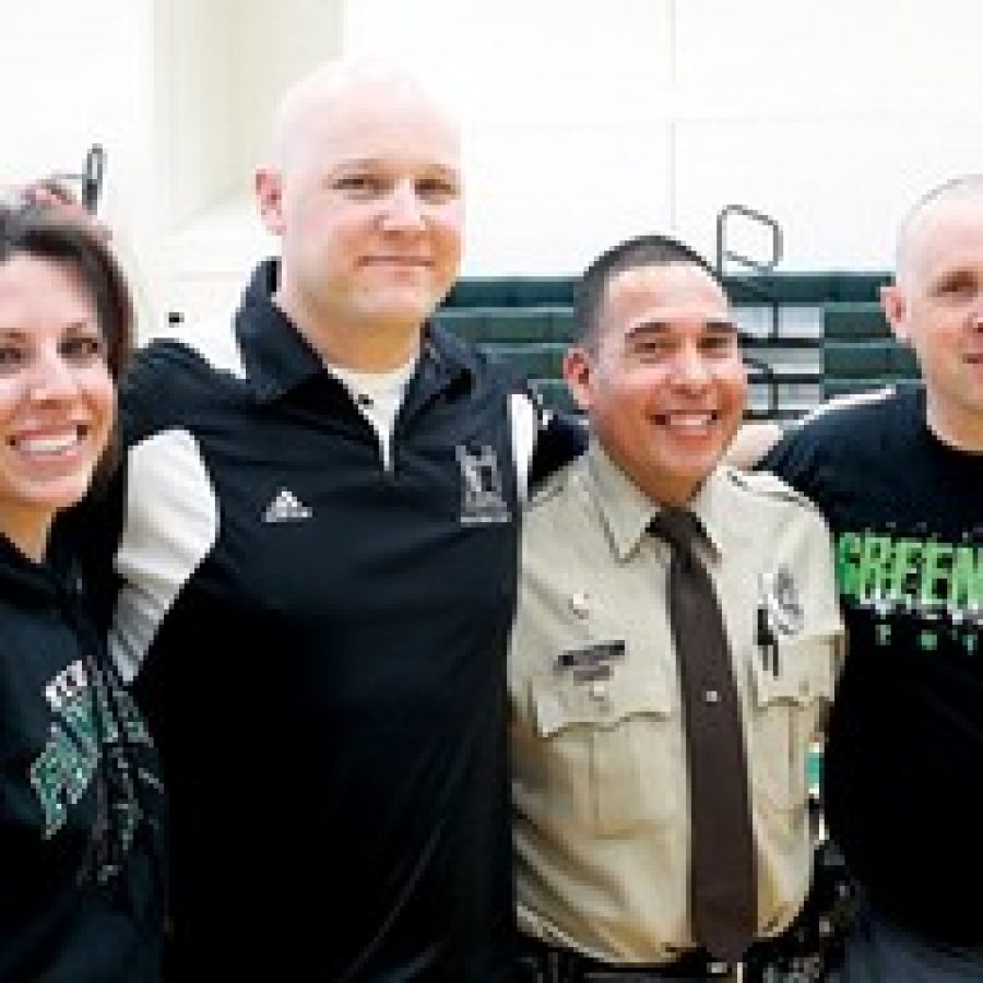 At the all-school assembly, from left, are:  Jackie Wamser, Kent Heinemann, School Resource Officer Charlie Rodriguez and Andy Guethle.  