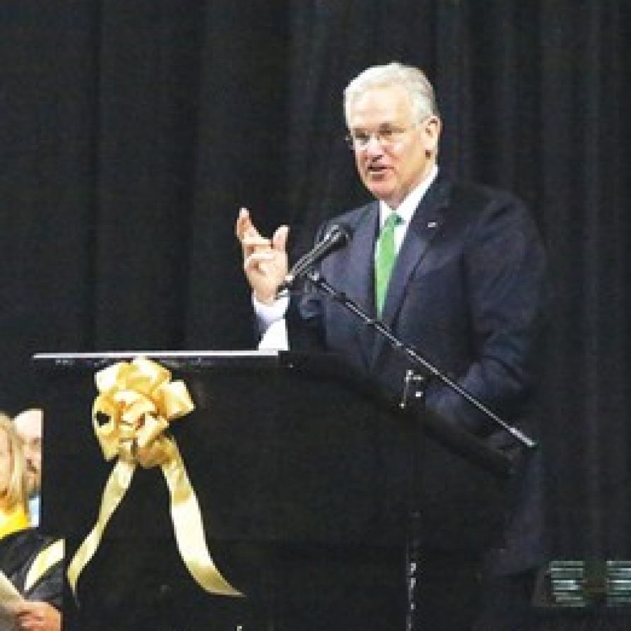 Gov. Jay Nixon congratulates Lindbergh High School graduates on their accomplishments and academic success, but told them in the future they will have to band together with those who dont agree with them to confront the worlds greatest challenges. 