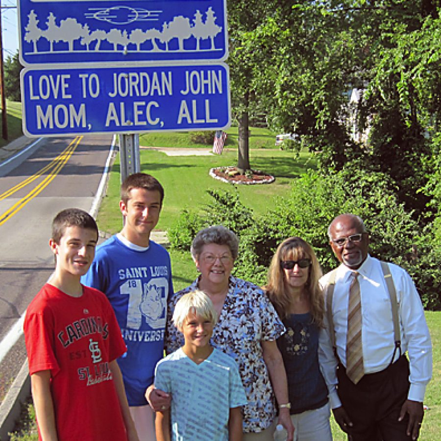 St. Louis County last week unveiled its upgraded Adopt a Roadside program at the intersection of Patterson Road and Marbury Drive in Oakville. County Executive Charlie Dooley was keynote speaker at the event. He was joined by south county resident Susan Berg, who recently adopted a segment of Patterson Road in memory of her son Jordan John Feager. Pictured, from left, are: Garrett Berg; Brett Berg; Alec Boswell, who is Jordan Feagers son; Mary Ann Jarzemkoski, who is Susan Bergs mother and Jordan Feagers grandmother; Susan Berg; and Dooley.