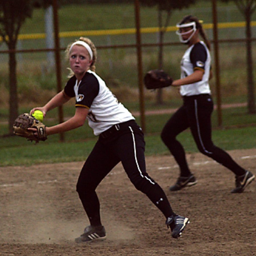 Oakville Senior High School third baseman Adrianna Wegmann makes the throw to first after fielding a ground ball in the sixth inning last week. Weg-manns throw for the third out against Parkway South was in an inning that was erased from the record books because of lightning strikes Sept. 2. Bill Milligan photo