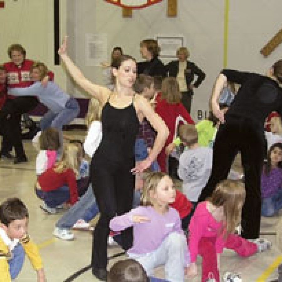 Members of the Mid America Dance Company perform an interactive dance with Hagemann Elementary pupils during the schools recent Fine Arts Fair.