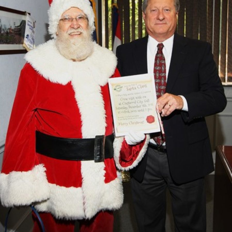 Santa Claus visits Crestwood City Hall and Mayor Gregg Roby in this photograph courtesy of Paul McAllister.