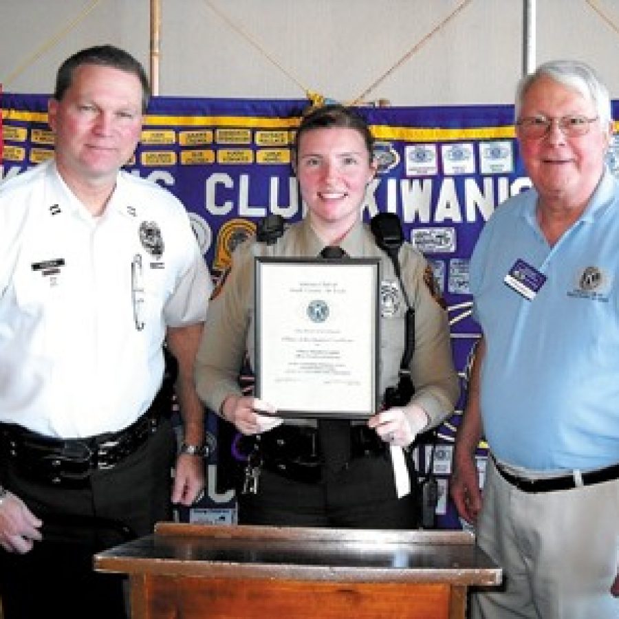 The Kiwanis Club Police Officer of the Quarter, Heather Lagulli, is pictured with Capt. Chris Stocker, left, and Kiwanis Club President Ed Kurmann, right.
