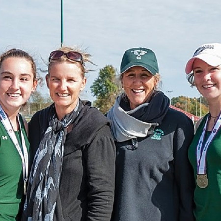 Lindbergh High School sisters Kat, far left, and Alex, far right, Rosenberger celebrate their Class 2 doubles state championship with their mother, Noel Quevreaux, middle left, and Shannon Cook. Quevreaux and Cook teamed up to win Lindberghs last doubles tennis title in 1984.