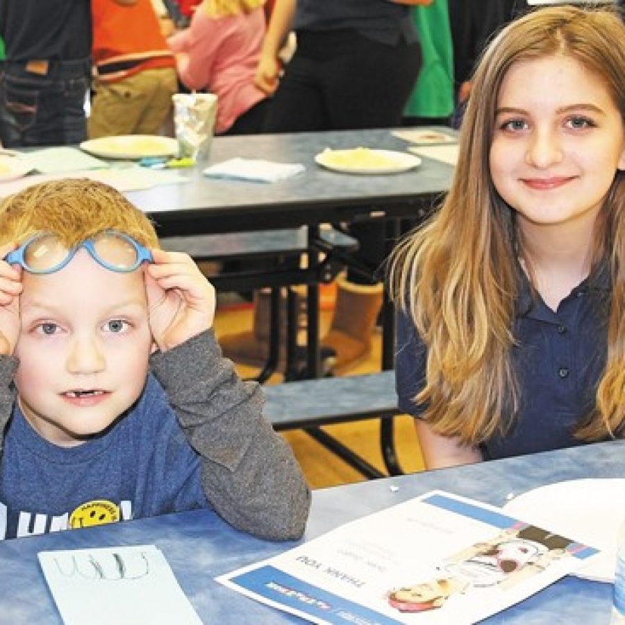 Blades first-grader Blake Givens and Washington Middle School eighth-grader Sabria Bender celebrate the success of Blades Mathathon for St. Jude.