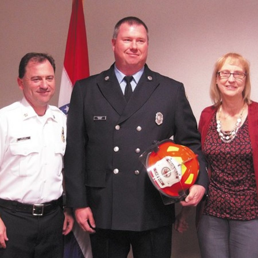Ed Glatzel Jr., center, is pictured with Mehlville Fire Protection District Chief Brian Hendricks and Board of Directors Treasurer Bonnie Stegman.