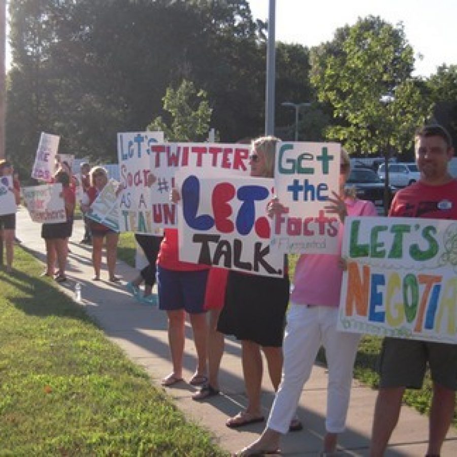 A line of Lindbergh teachers picketing outside the Aug. 19 Board of Education meeting.