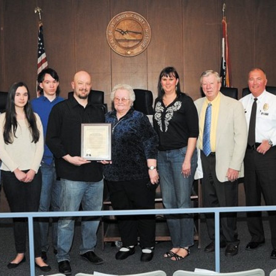 Green Park resident Ronald Kramer is pictured with the Citizen Service Citation presented to him by the county Board of Police Commissioners. Also pictured are Kramers wife, children and parents, along with Green Park Mayor Bob Reinagel, St. Louis County Police Chief Jon Belmar and Capt. Christopher Stokes.