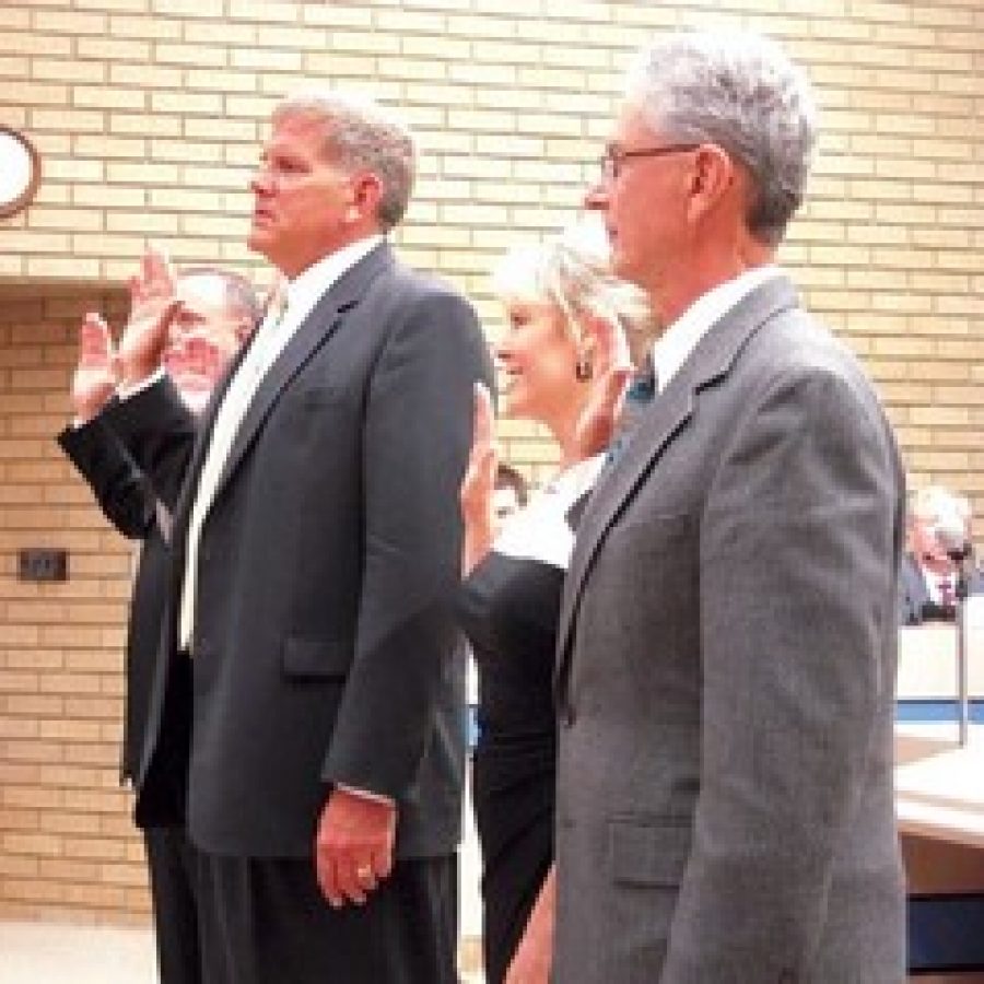 Mayor Mark Furrer being sworn in last year. Pictured from left are Ward 1 Alderman Richard Gau, Furrer, Ward 4 Alderman Donna Ernst and acting board President Tom Musich as they were sworn in by former City Clerk Laura Rider last year.