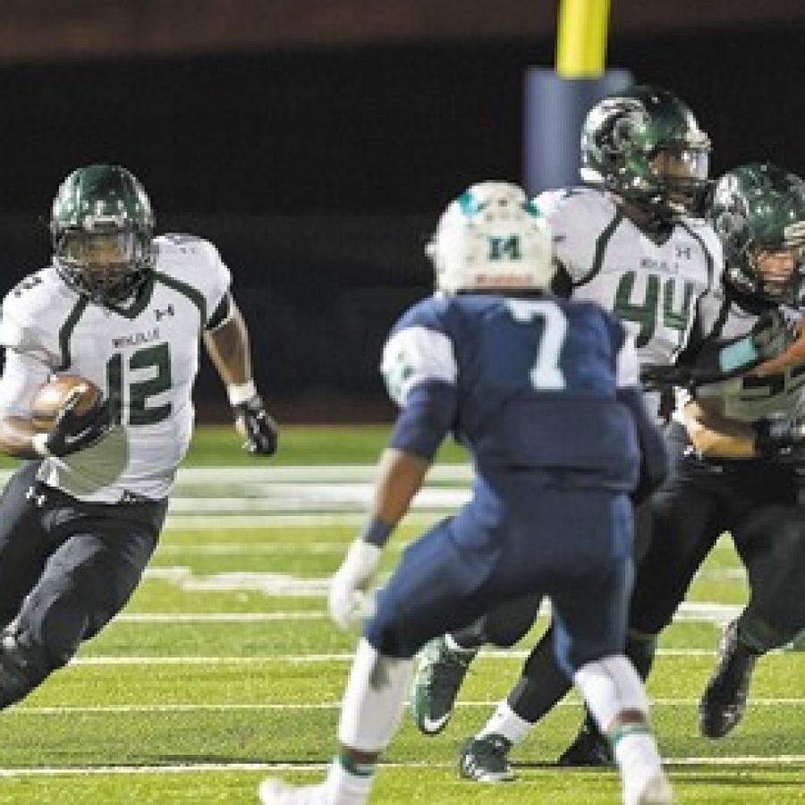 Megan LeFaivre-Zimmerman photo
Marquette High Schools Xavier Jackson, No. 7, above, pursues Mehlvilles Josh Handley, No. 12, in Friday nights game. The Panthers fell 48-0 to the Mustangs to end their 2015 season.