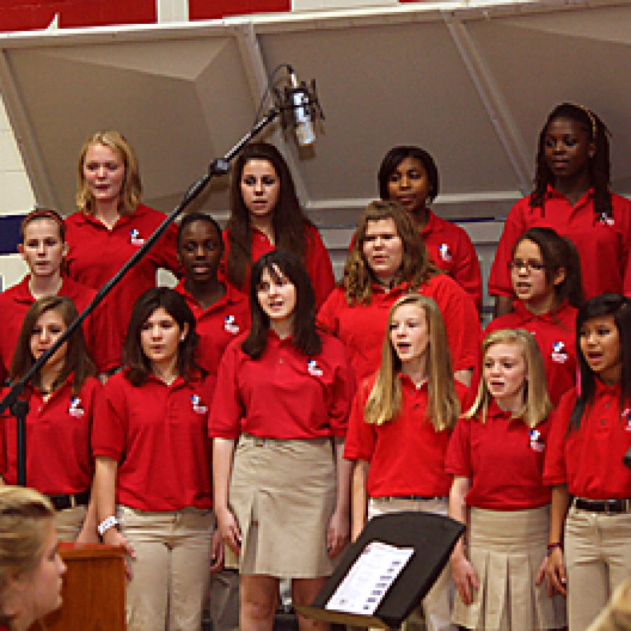 The Bernard Middle School Concert Choir, above, performs during the school's sixth annual Veterans Day Tribute Concert last week. Besides Bernard's Concert Choir, the audience of more than 1,000 people was treated to performances by Bernard's Symphonic Band and Orchestra, along with the Oakville High Concert Choir.