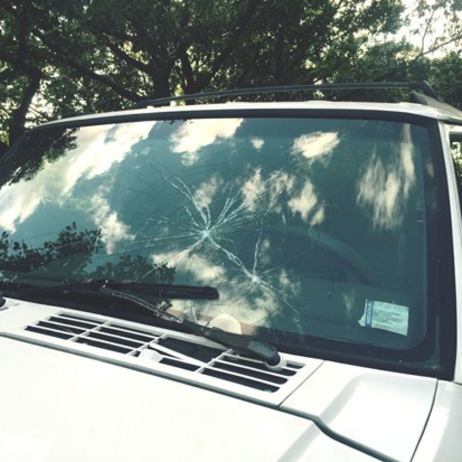 The crack in the windshield, seen above, in the Jeep of the 16-year-old Oakville High student who allegedly ran over a man Sunday night shows that the boy was justified to try to escape the situation, the boys father says.