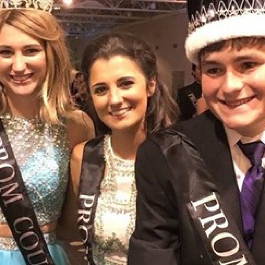 Prom King Matt Schmitt, right, with, from left, Prom Queen Breanna Colombo and Sophie Nelms, a member of the prom court, at Oakville High Schools prom. 