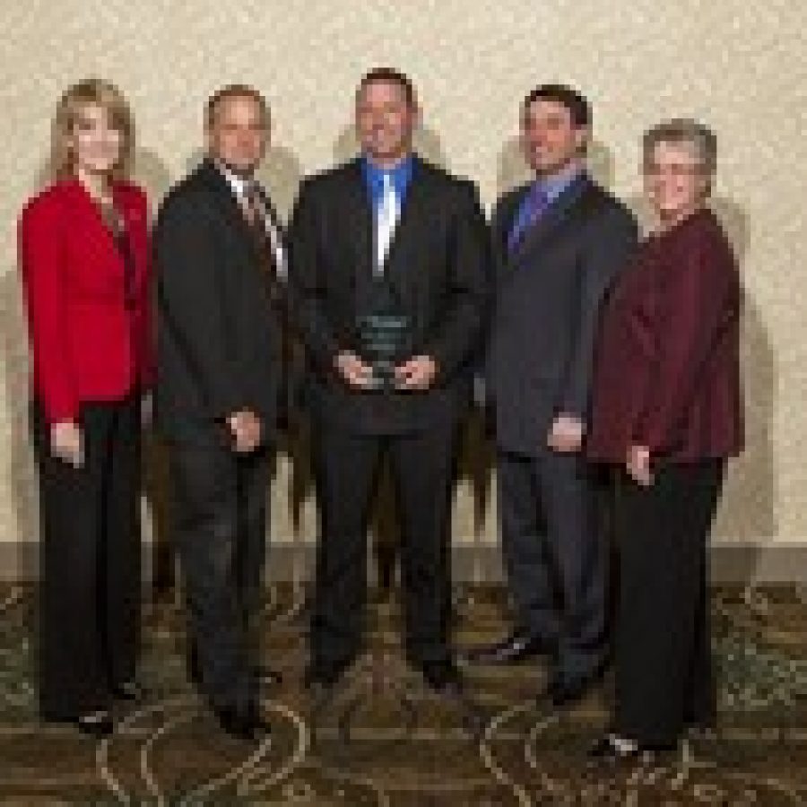 Tom Dittrich, Jr. accepts the Edgar P. Crecelius Service Award
from the Lemay Chamber of Commerce. From left: Julie Leicht, John Judd, Tom Dittrich, Jr., County
Councilman Steve Stenger, State Representative Cloria Brown.
Photo Credit: davidjstudios photography 