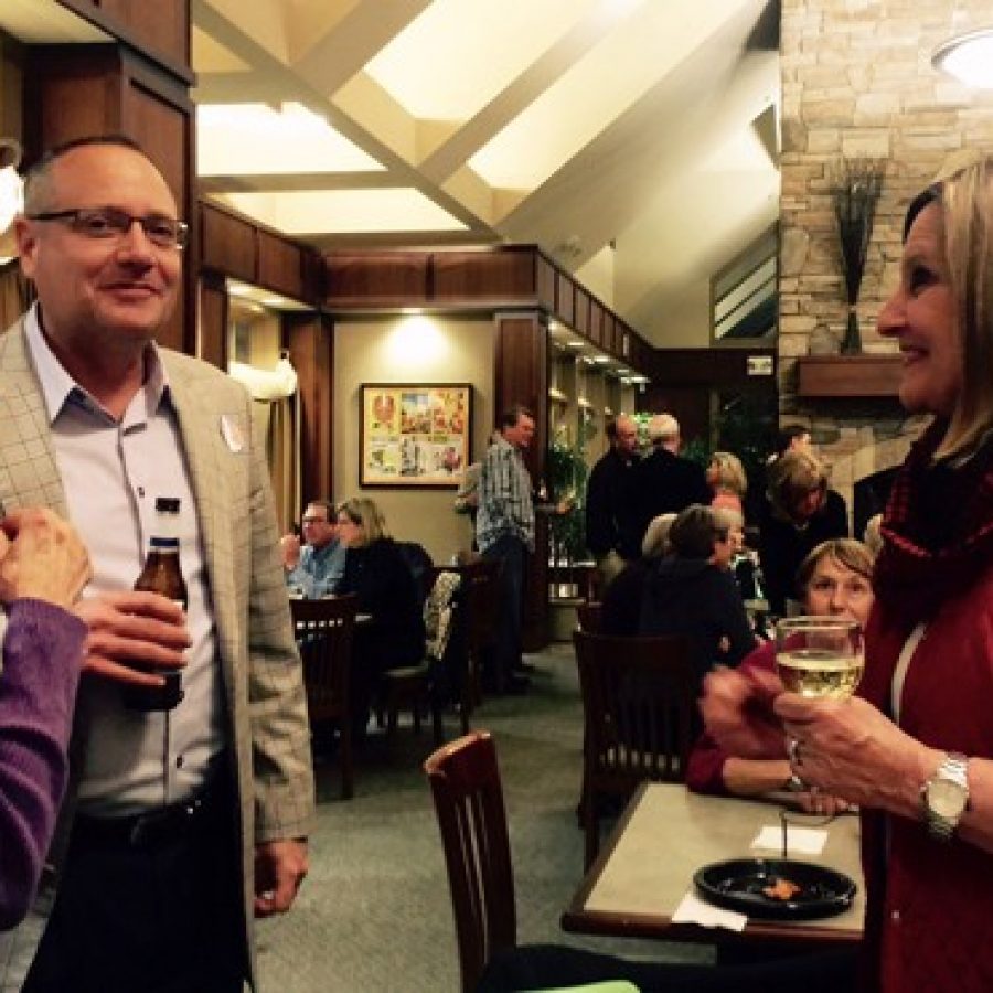 Ward 1 Alderman Richard Gau, middle, talks to Ward 4 Alderman Pat Fribis, right, at Fribis mayoral watch party at Tapawingo Tuesday night. Gaus ward was one of the ones affected by countywide ballot shortages.