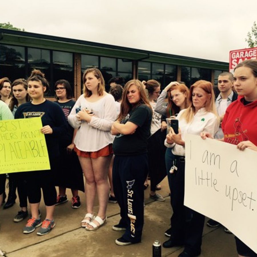 Students protesting teacher salaries listen as #LindberghCares organizers outline the game plan for how to occupy Lindbergh Central Office May 27.