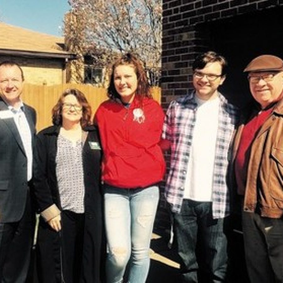 Delivering Meals on Wheels on Good Friday in Lemay last week are, from left, Hancock Place Superintendent Kevin Carl, South County Senior Center Administrator Pamela Guest, Hancock students Adrienne Compton and Timothy Walden, and Rep. Bob Burns, D-Affton. Gloria Lloyd photo